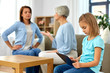 © Syda Productions - family, generation and parenting concept - daughter with tablet computer, mother and grandmother arguing at home
