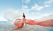 © oes - Slim Woman at the beach with long pink fabric. Sky background at the summer. Classic dancer on the nature