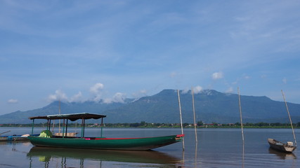 Wall Mural - Boat tour of the villagers landing alongside the Mekong River.