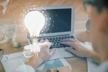 Growing arrows with businessman working on computer on background. Success concept. Double exposure.