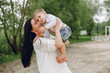 © hetmanstock2 - Family in a summer park. Mother in a white dress. Cute little boy