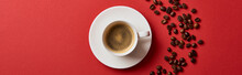 Top View Of Delicious Coffee In Cup Near Roasted Beans On Red Background, Panoramic Shot