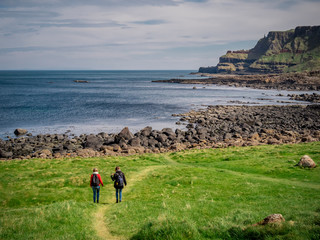 Two girls travel to Giants Causeway in Northern Ireland - travel photography