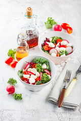 Wall Mural - Salad with cherry tomatoes, radsh and mozzarella, lettuce mix