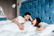 © Тарас Нагирняк - Family, rest and relationships concept - happy couple sleeping in bed at home