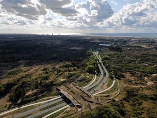 Wall Mural - Aerial image of ecoduct crossing highway in dunes national park in the Netherlands