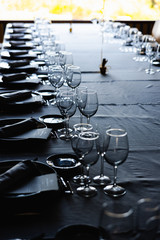 Wall Mural - Living room with table to celebrate a birthday meal inside a house, cutlery and glasses prepared by a catering.