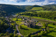 Aerial Panoramic View Of The Ruins Of Tintern Abbey, A Cistercian Monastry Located By The River Wye In South Wales, UK