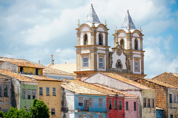 Colorful historic district of Pelourinho with cathedral on the background. The historic center of Salvador, Bahia, Brazil. Historic neighborhood famous attraction for tourist sightseeing. 