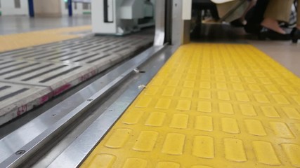 Canvas Print - Zooming in to the train door in upper view while the door is closing 