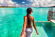 © Maridav - Follow me beach couple man holding girlfriend hand following woman to the swimming pool blue ocean vacation in Bora Bora, Tahiti ,French Polynesia.