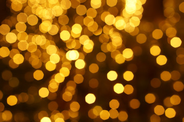 Wall Mural - Abstract blurred and bokeh of party yellow LED reflection lighting on night time background.