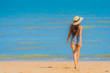 © siraphol - Portrait beautiful young asian woman happy smile relax on the tropical beach sea ocean for leisure travel