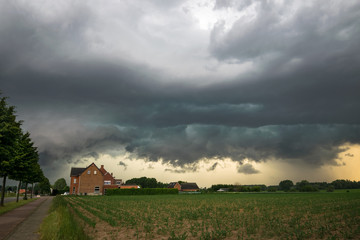 ominous sky as the gust front of a severe thunderstorm is moving fast over the landscape of eastern 