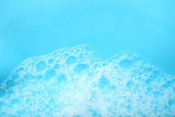 Background soap suds (foam) and bubbles from detergent. House cleaning concept.