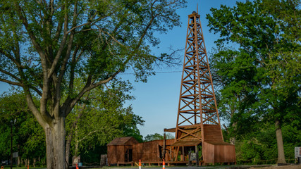 image of park & wooden oil well, shot at pathfinder parkway, city of bartlesville