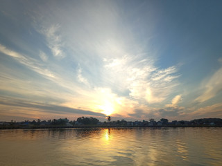 Wall Mural - the sky with the sun will rise in the river