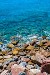 Sticker - an Aerial view of ocean waves and Rocky coast