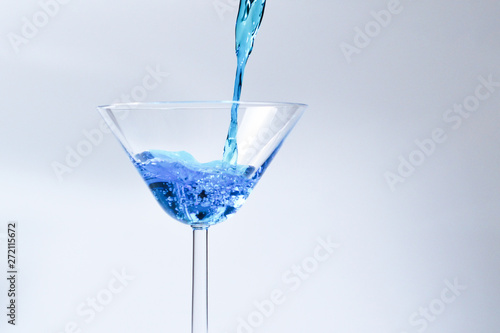 Foto  Cocktail with blue liquid in glass
