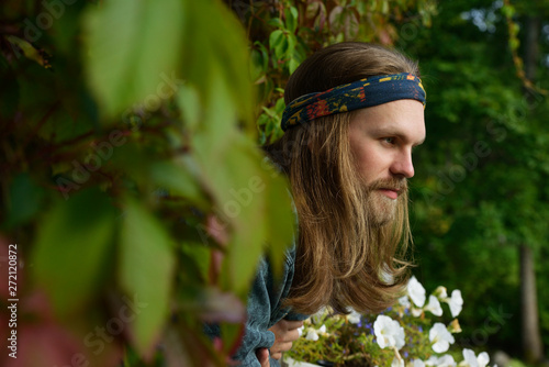 Profile Portrait Of A Young Man With Long Hair And Beard In A