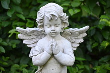 A White Sandstone Sculpture Of A Praying Angel.