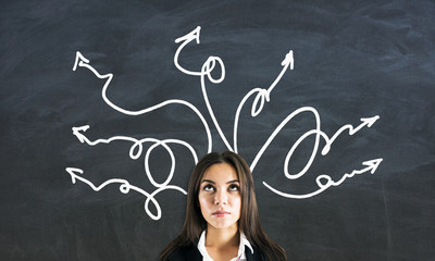 Wall Mural - Portrait of businesswoman with arrows