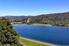 Clear Blue Reservoir Set In The Hills In North Island, New Zealand