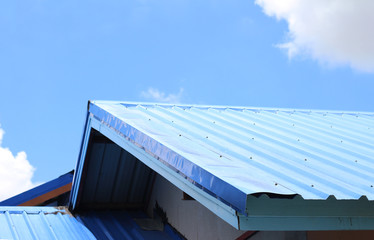 blue metal sheet zinc roof with blue sky