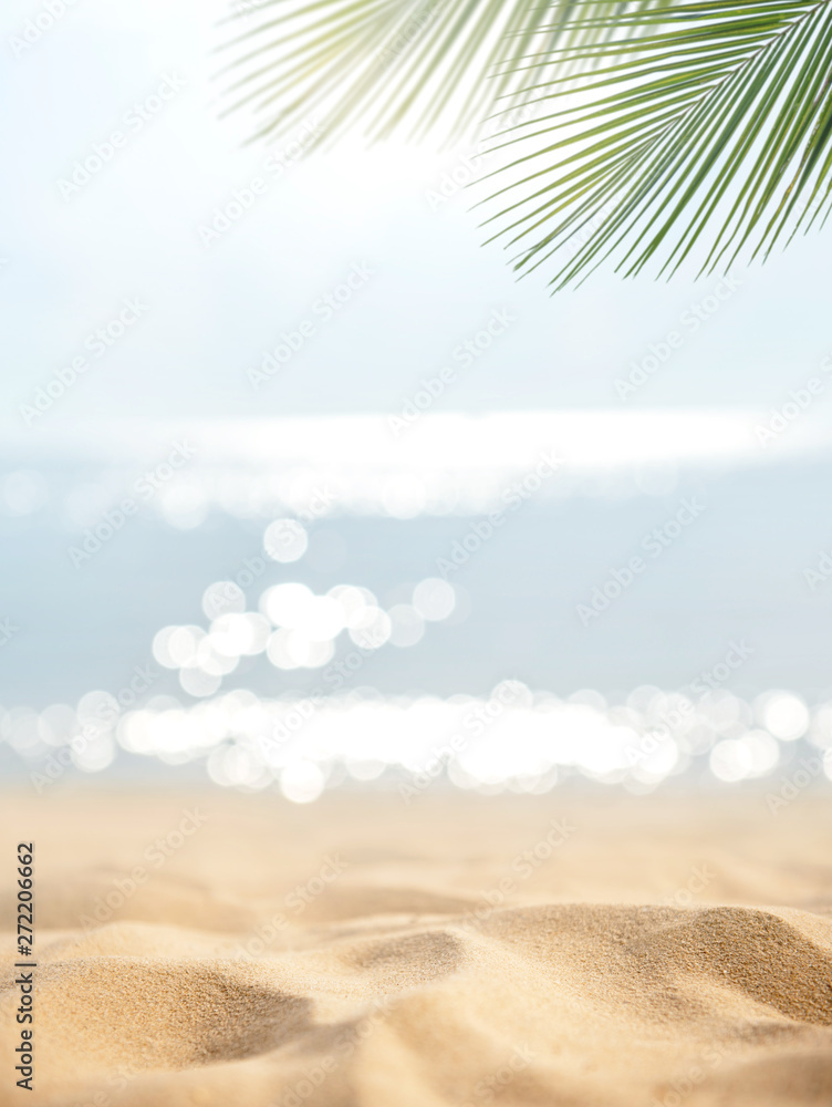Sand with blurred Palm and tropical beach bokeh background, Summer vacation and travel concept. Copy space - obrazy, fototapety, plakaty 