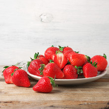 Fresh Strawberries In Plate On Wood