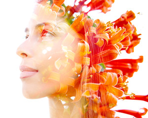 Double exposure profile of a natural beauty with lush orange flowers which seemingly grow from her hair, against a white background