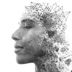 Double exposure. Paintography. Close up portrait of an attractive woman with strong ethnic features combined with unusual hand drawn painting, black and white