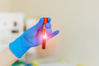 © Vadim - hand of doctor holding blood sample in tube test for analysis in laboratory