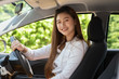 © 220 Selfmade studio - Beautiful attractive young woman smile in casual sitting in car,Diving car with confident and happiness feeling,Happy transport concept