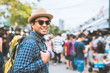 © Nopphon - Traveling man walking at Chatuchak Market in Bangkok Thailand.
