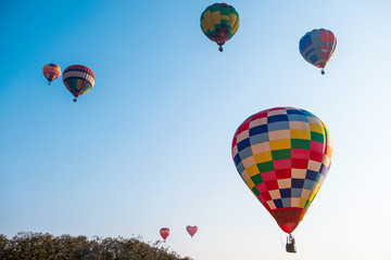 Colorful hot air balloon on blue sky - Image