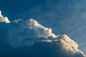 Wall Mural - blue sky with clouds and sun, sunset