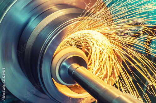 Cuadros en Lienzo Internal grinding of a cylindrical part with an abrasive wheel on a machine, sparks fly in different directions