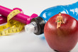 © Fertas - Mineral water,apple, tape measure heaviness for healthy life with sport.