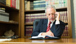 © Minerva Studio - Businessman talking phone in office