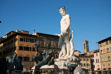 Wall Mural - Florence, Italy - April 15, 2019: View of The Fountain of Neptune in Piazza della Signoria