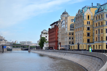 Wall Mural - Moscow, Russia - May 13, 2019: Buildings on the Yakimanskaya Embankment and Moscow River on a sunny day