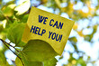 © Artur - Word writing text We Can Help You. Business photo showcasing offering good assistance to customers or friends Piece of square paper use to give notation on tree leaf under sunny day
