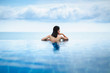 © Peera - Asian woman relax in pool on beach