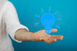 © vegefox.com - holding illuminated light bulb, idea, innovation and inspiration concept.
