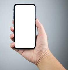 Man hand holding the smartphone full screen with blank screen . isolated on gray background.