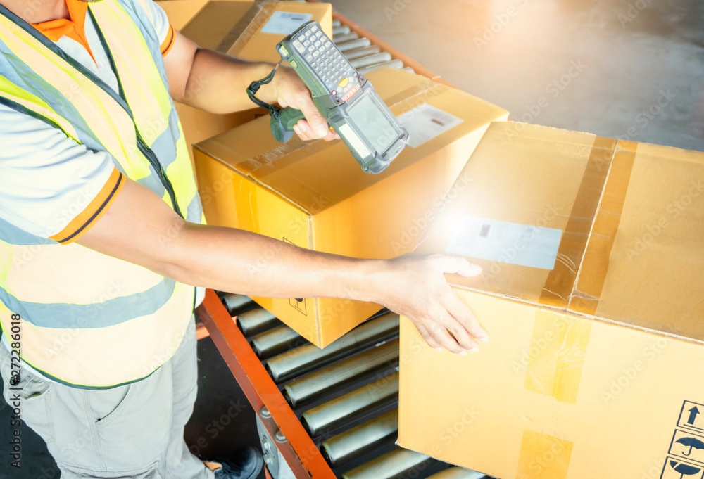 Workers Scanning Bar Code Scanner on Packaging Boxes. Shipping ...