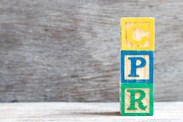 Poster - Color letter block in word CPR (abbreviation of Cardiopulmonary resuscitation) on wood background