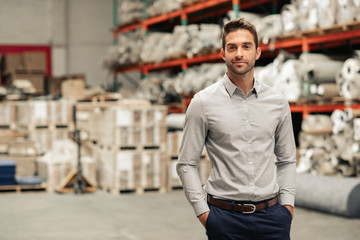 Warehouse manager standing on the floor of his warehouse