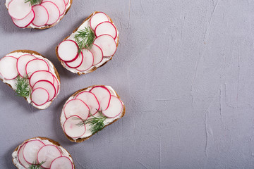 Wall Mural - Healthy vegetable toasts sandwith with radish and dill